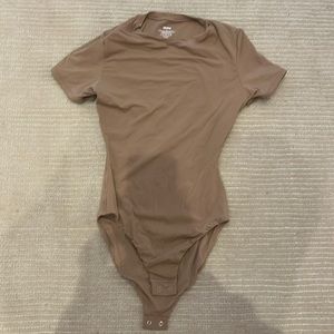 Skims bodysuit in a mocha color size Xs